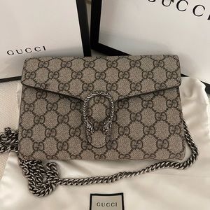 Gucci Dionysus GG Supreme chain wallet.